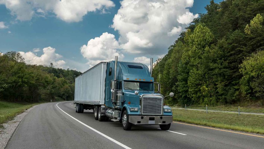 Heavy-duty truck on the road representing reliable aftermarket truck parts available to buy online with fast shipping.